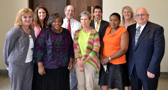 20 Years of Service:  Front, from left, Shelia Millican, senior secretary, Commercial Aviation; Rendia Lark, assistant teacher, Child Development Center; Emily Herbison, nurse, Student Health Services; Juanita Hooper, custodian, Custodial Services; James Marquis, Jr., electrical supervisor, Facilities Management;  Back, from left, Dr. Michelle Roberts, vice president, University Relations;  Joseph Abide, associate professor, Department of Art; Robert Rushing, professor, Department of Art; and Michelle Enriquez, lead teacher, Child Development Services.  Family and friends joined the honorees for a reception following the ceremony. 